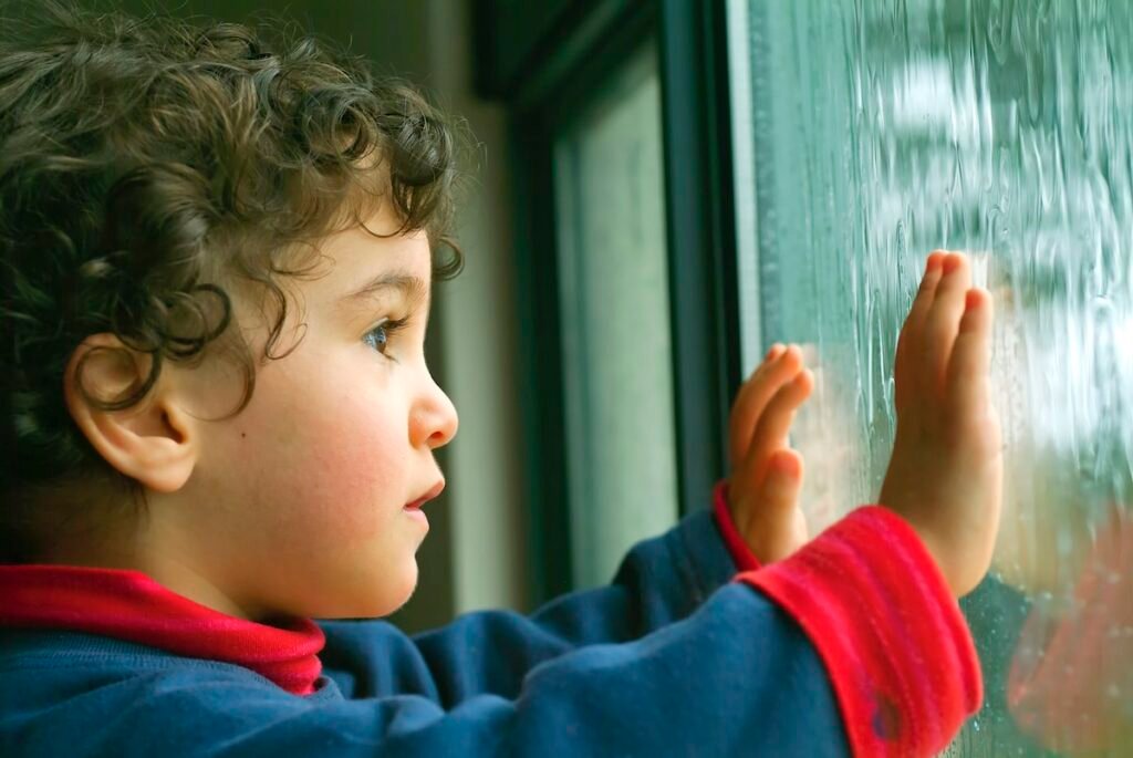 Toddler Entertained on a Rainy Day